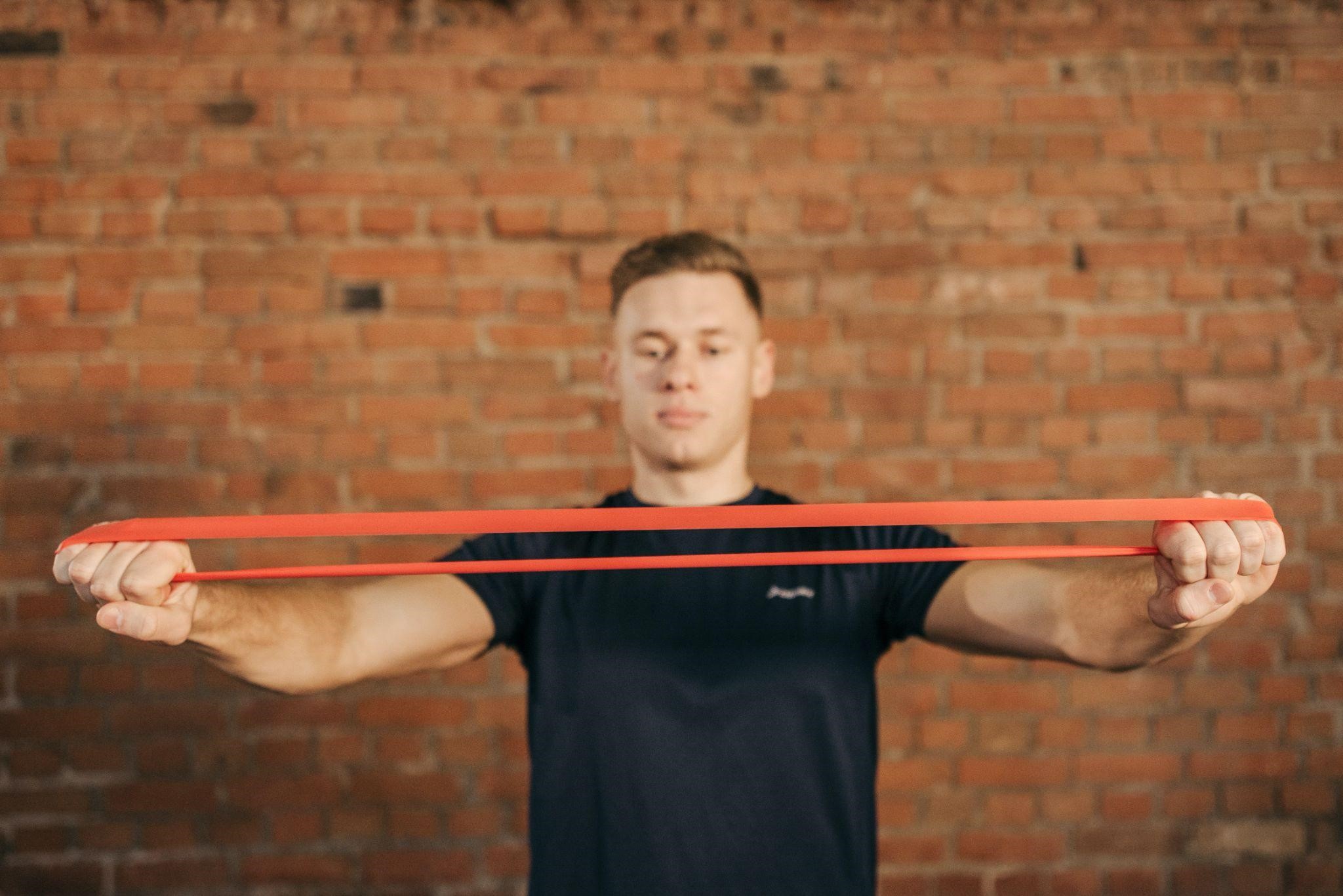 a man holding a resistance band